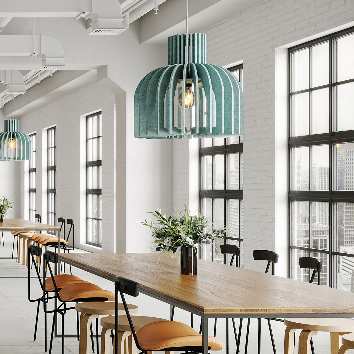 Teal Amien Harmony acoustic pendant lights above a long table in a bright modern space