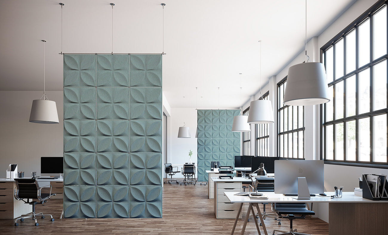Ocean felt Chrysalis hanging acoustic dividers creating separation in a bright office