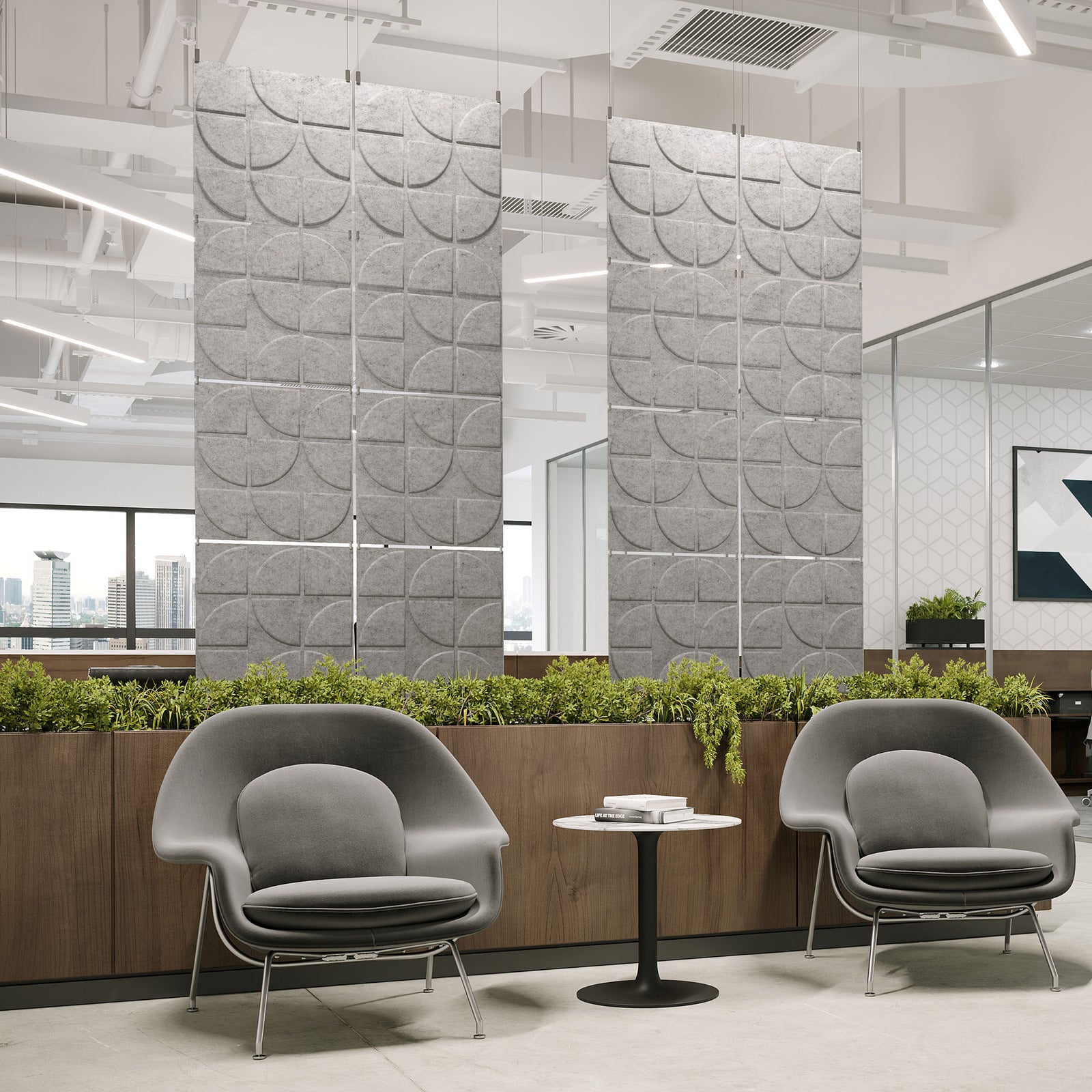 Light gray Rend Harmony3D PET felt hanging acoustic panels dividing a modern office seating area by Inhabit