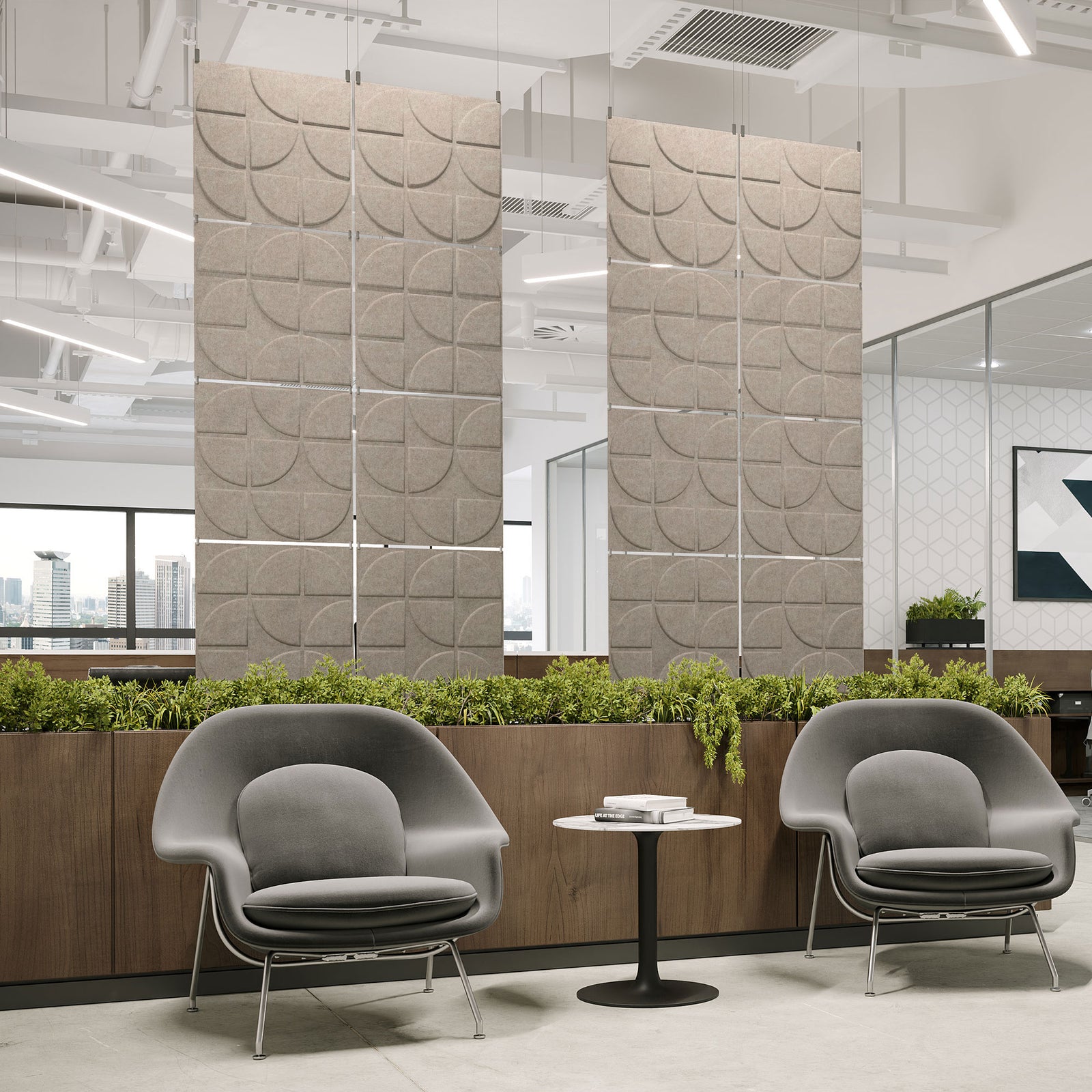 Sand-colored Rend Harmony3D PET felt hanging acoustic panels dividing a modern office seating area