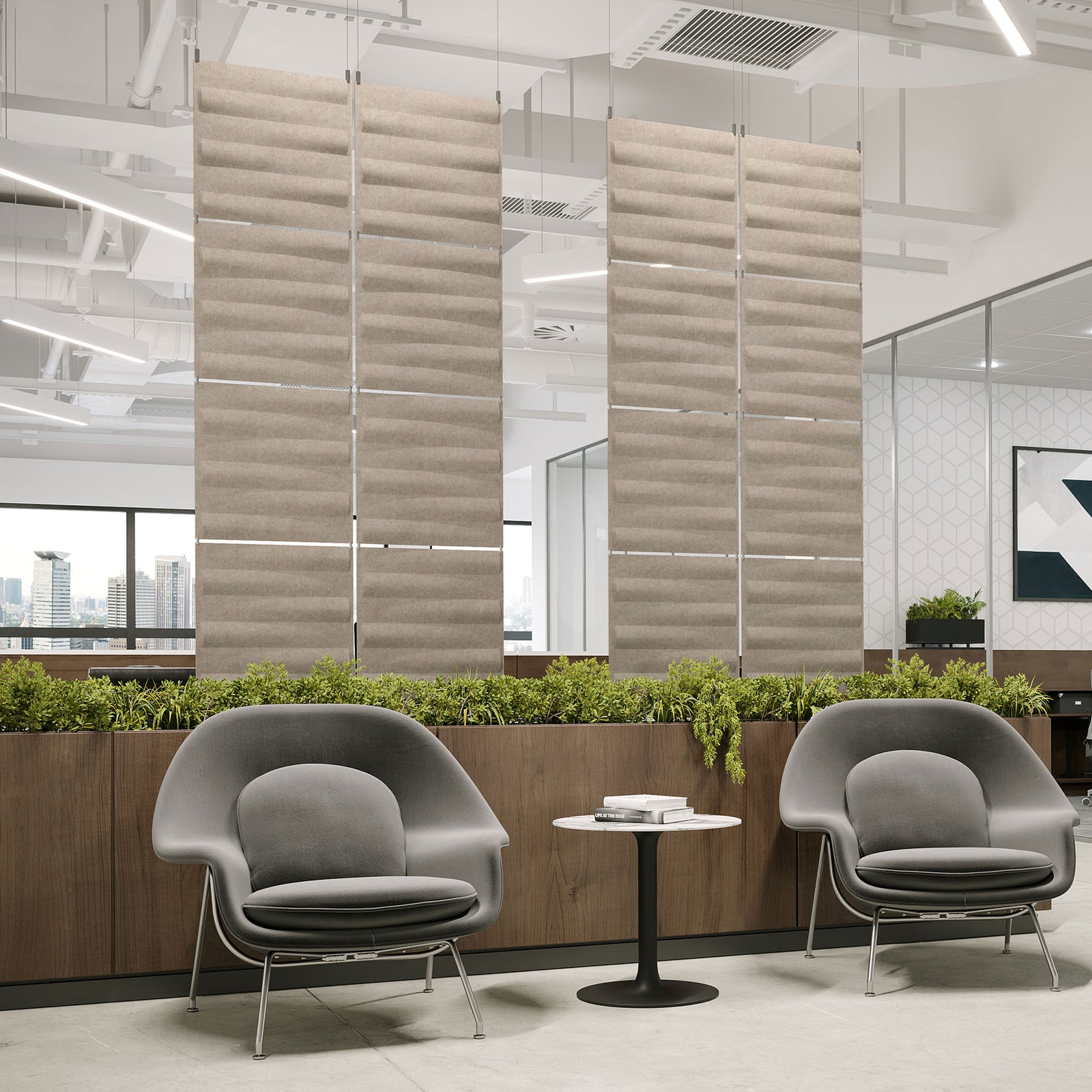 Sand-colored Seesaw Harmony3D PET felt hanging acoustic panels dividing a modern office seating area
