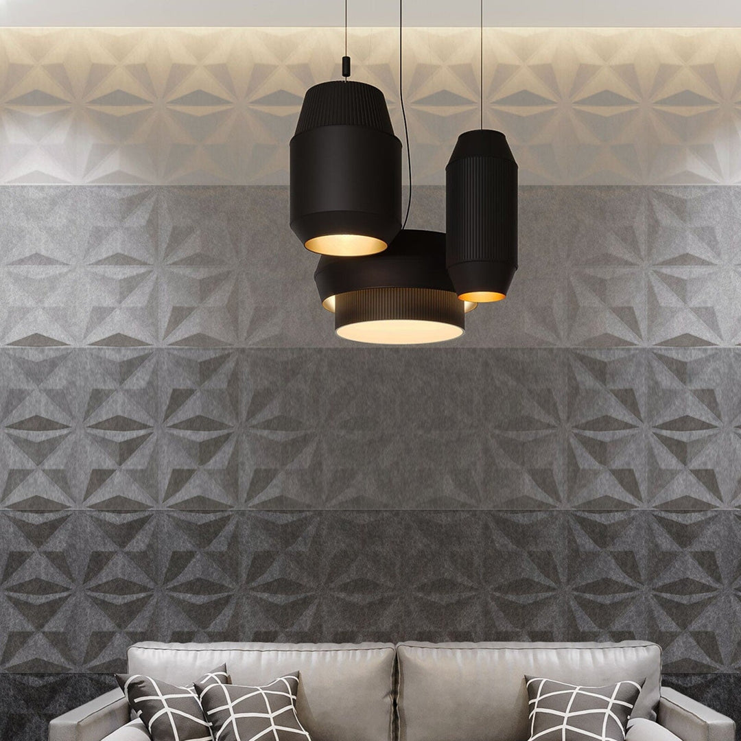 Close view of gray ombre Facet Harmony3D acoustic felt wall panels in a modern lounge