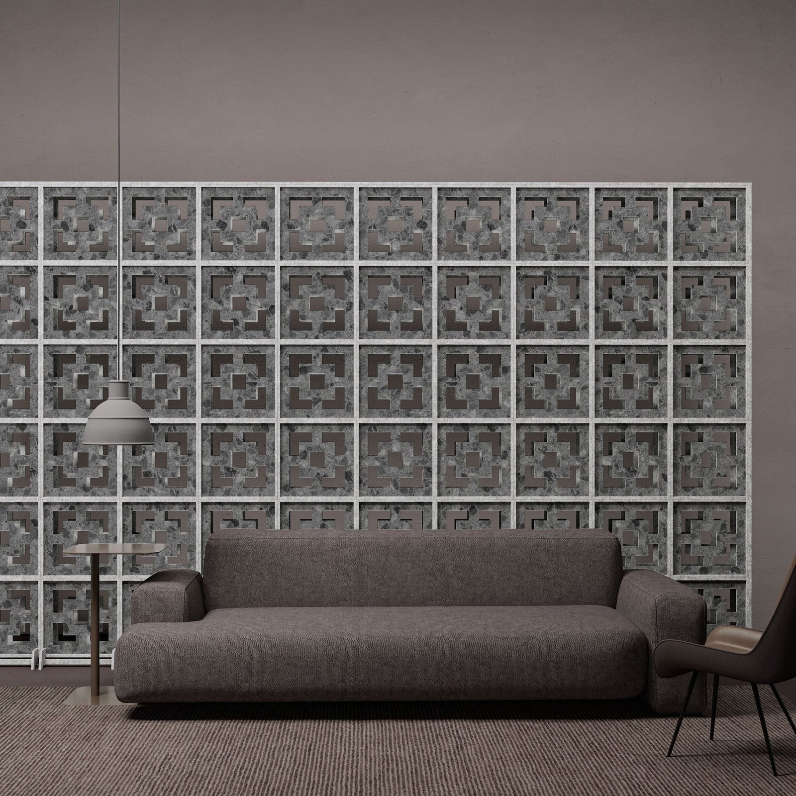 Gray terrazzo Frame HarmonyBLOKS acoustic room divider by Inhabit behind a sofa