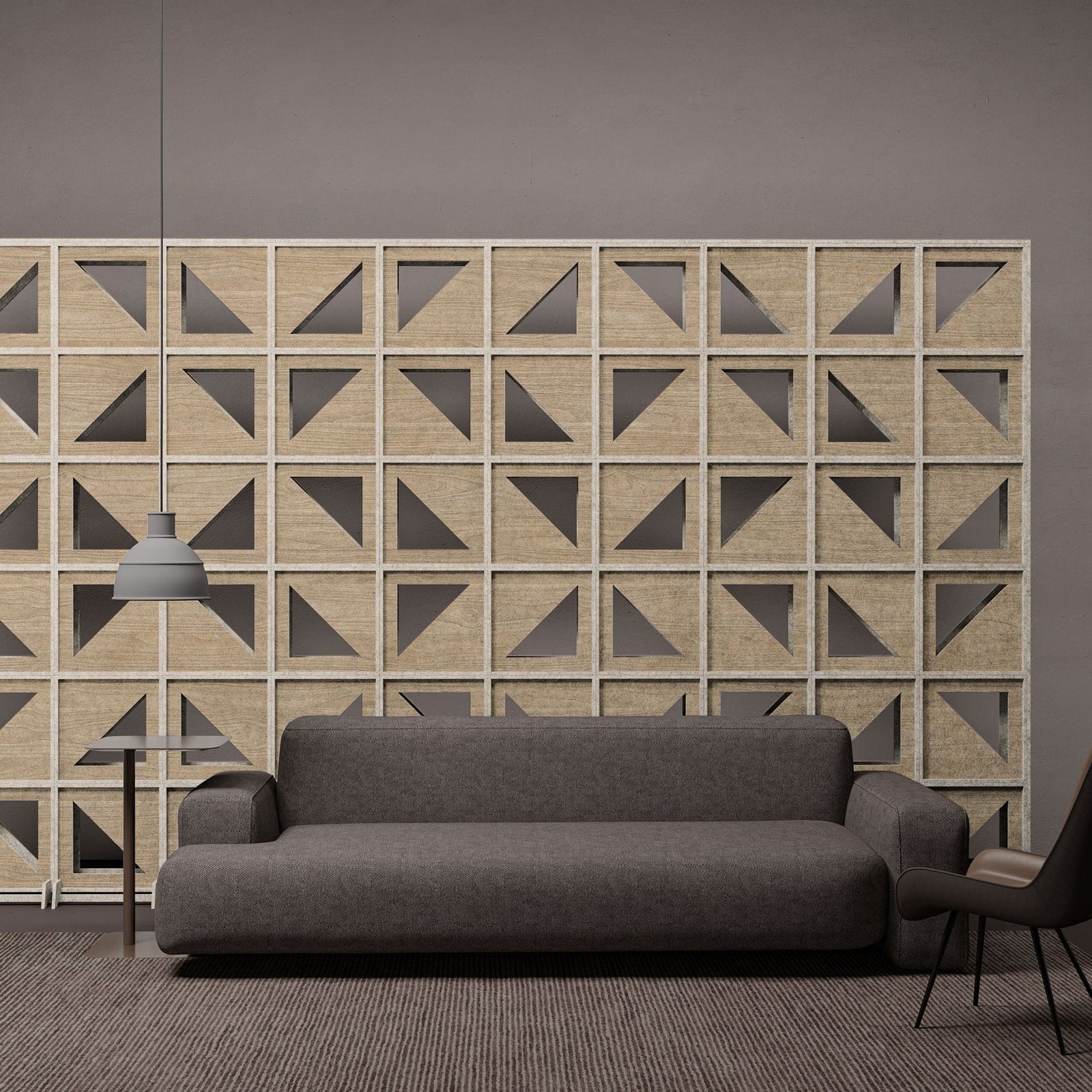 Hatch HarmonyBLOKS wood-grain acoustic room divider behind a gray sofa by Inhabit.