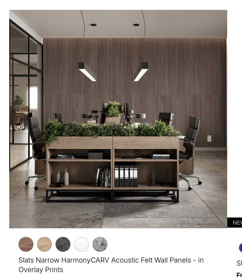 Acoustic slat wall panels behind a modern open office workspace