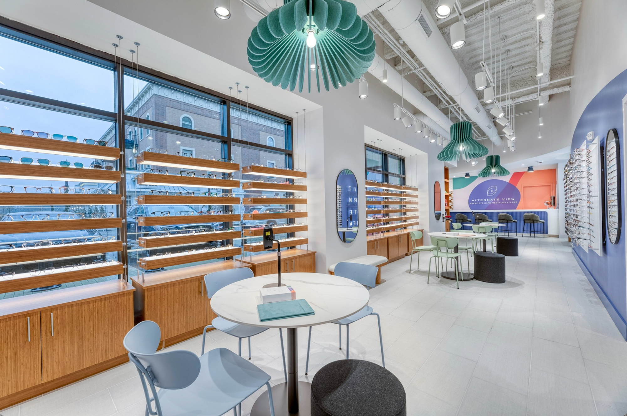 Teal Amien Harmony acoustic pendant lights in a bright modern optical retail store