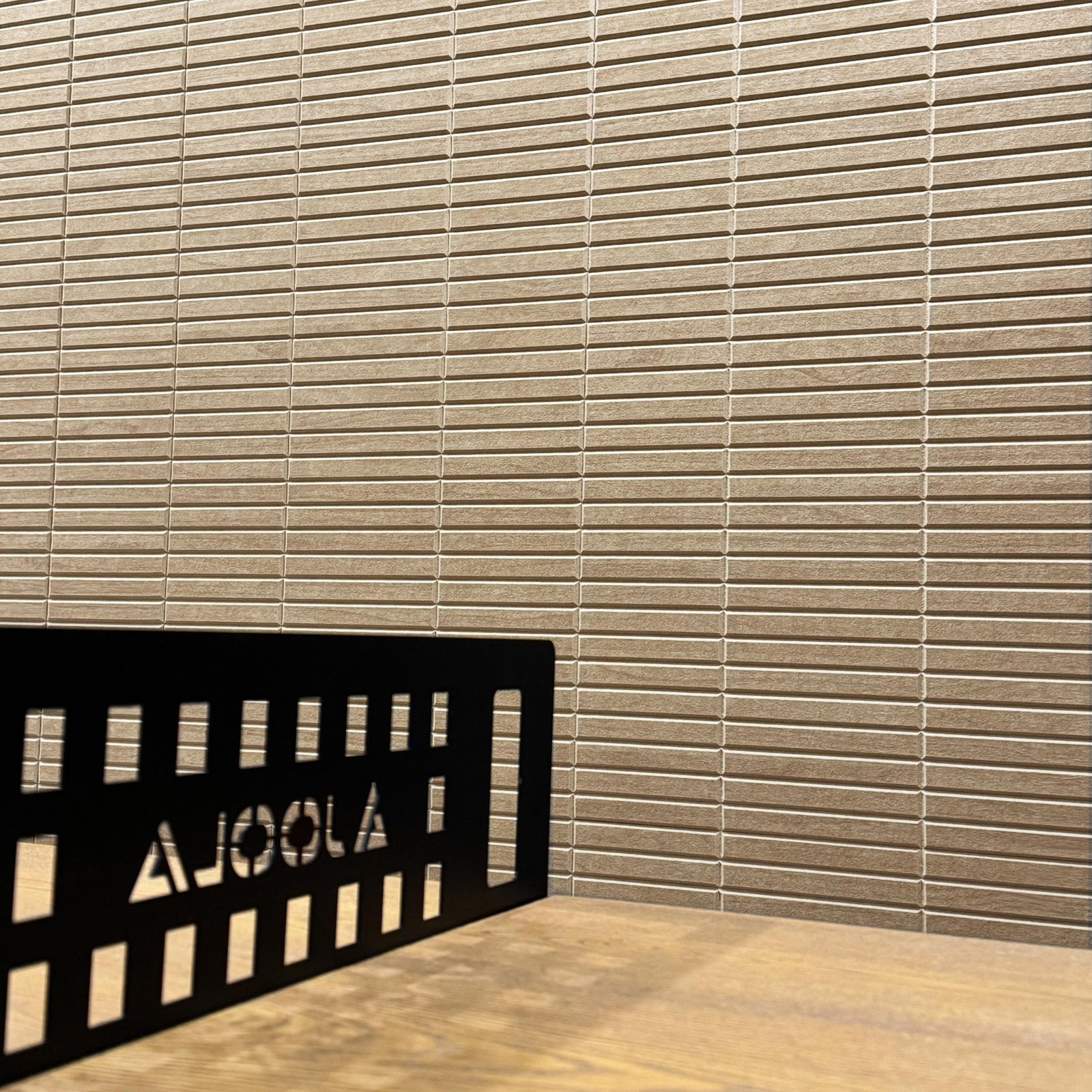Ribbon HarmonyCARV light wood-grain panels on a modern feature wall.