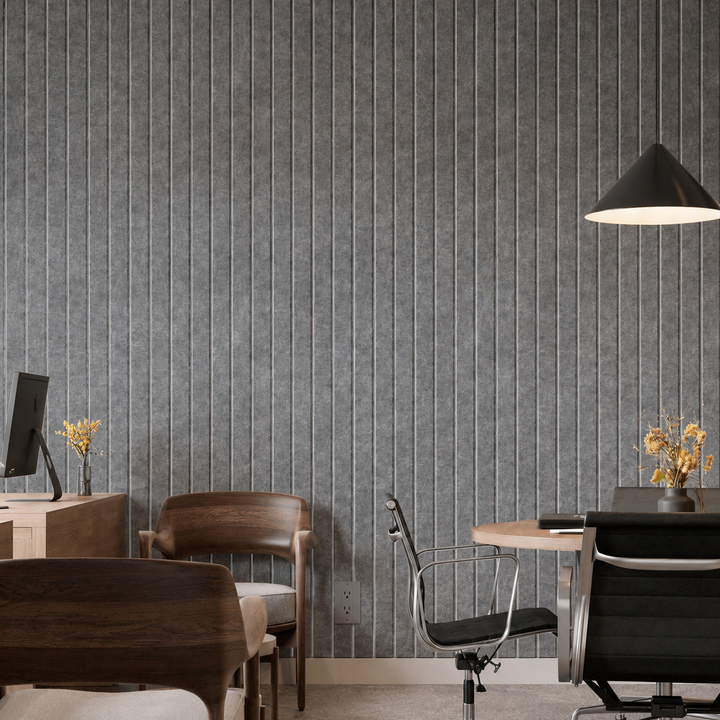 Close-up of Slats Wide HarmonyCARV acoustic felt wall panels installed in a modern interior