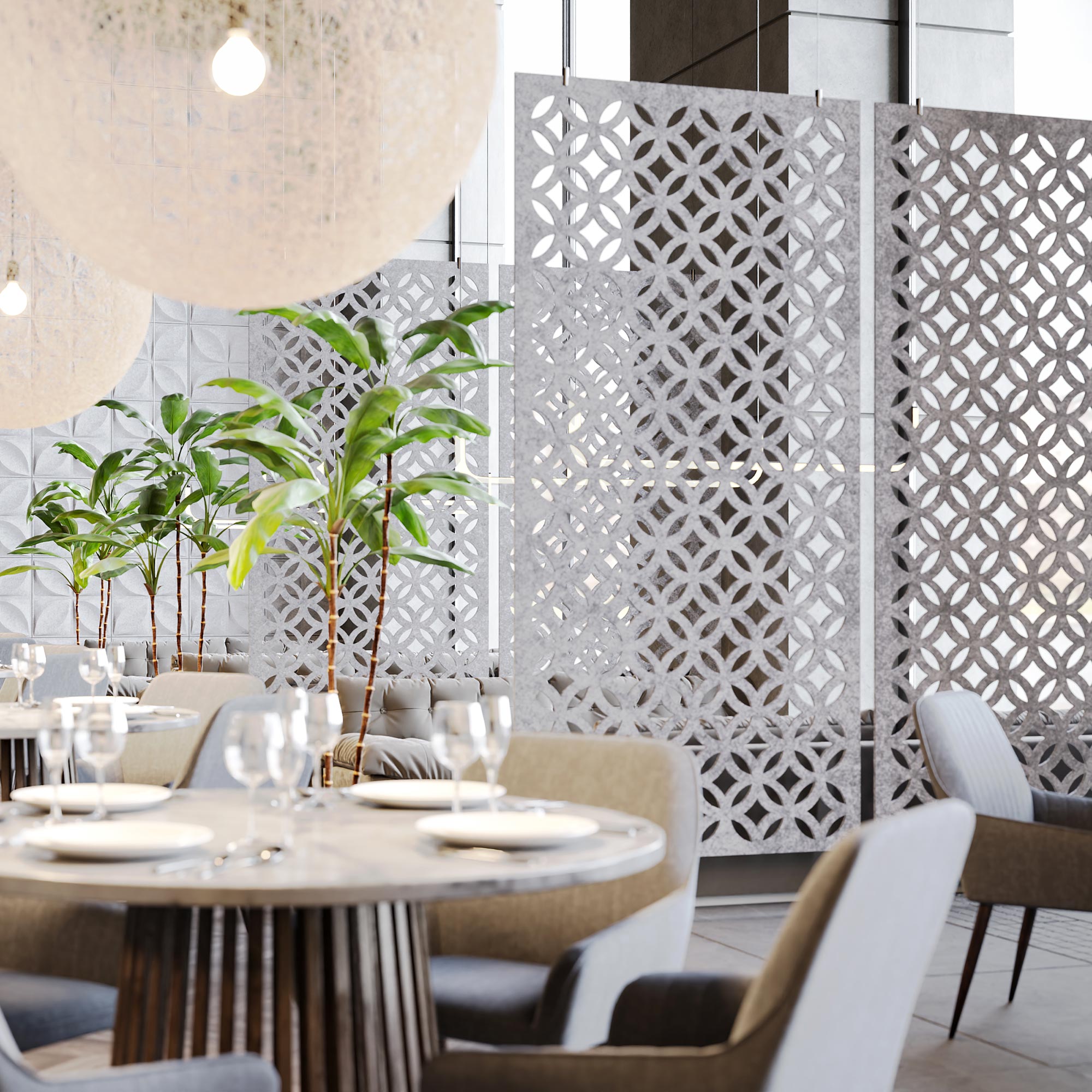 Light gray Chrysalis HarmonyDIVDR acoustic felt dividers defining seating in a commercial interior