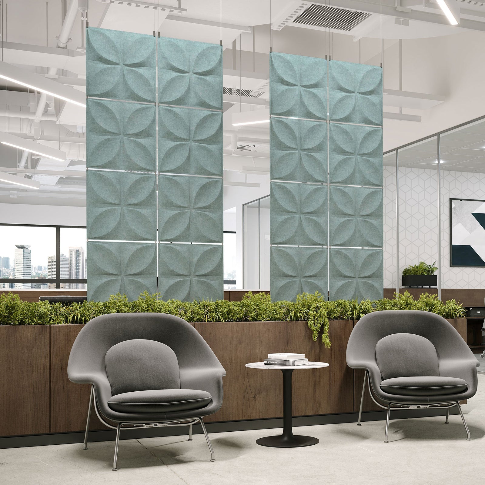 Pale blue Chrysalis Harmony3D PET felt hanging acoustic panels dividing a modern office seating area