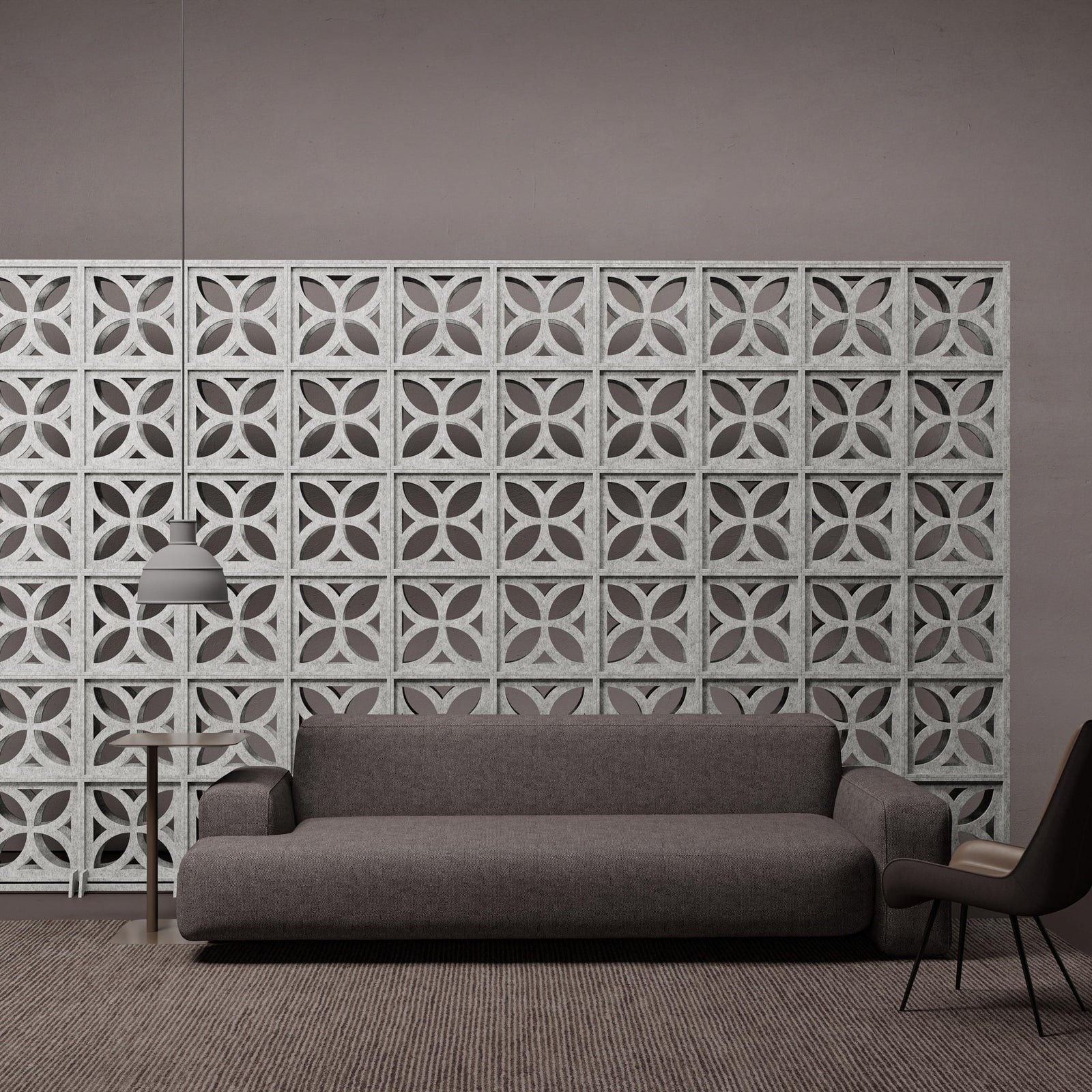 Light gray Chrysalis HarmonyBLOKS acoustic room divider by Inhabit behind a sofa