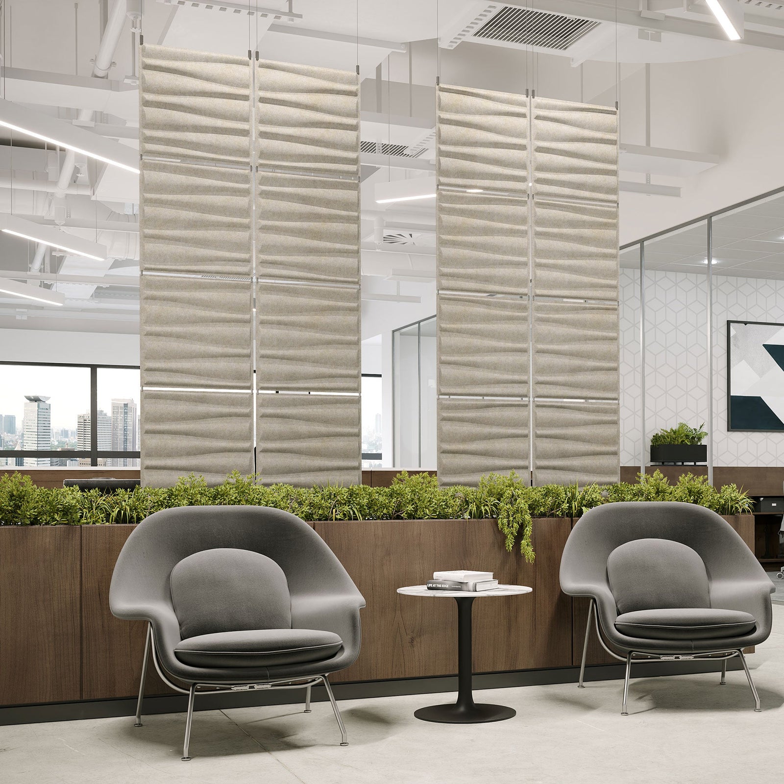 Ivory Drift Harmony3D PET felt hanging acoustic panels dividing a modern office seating area