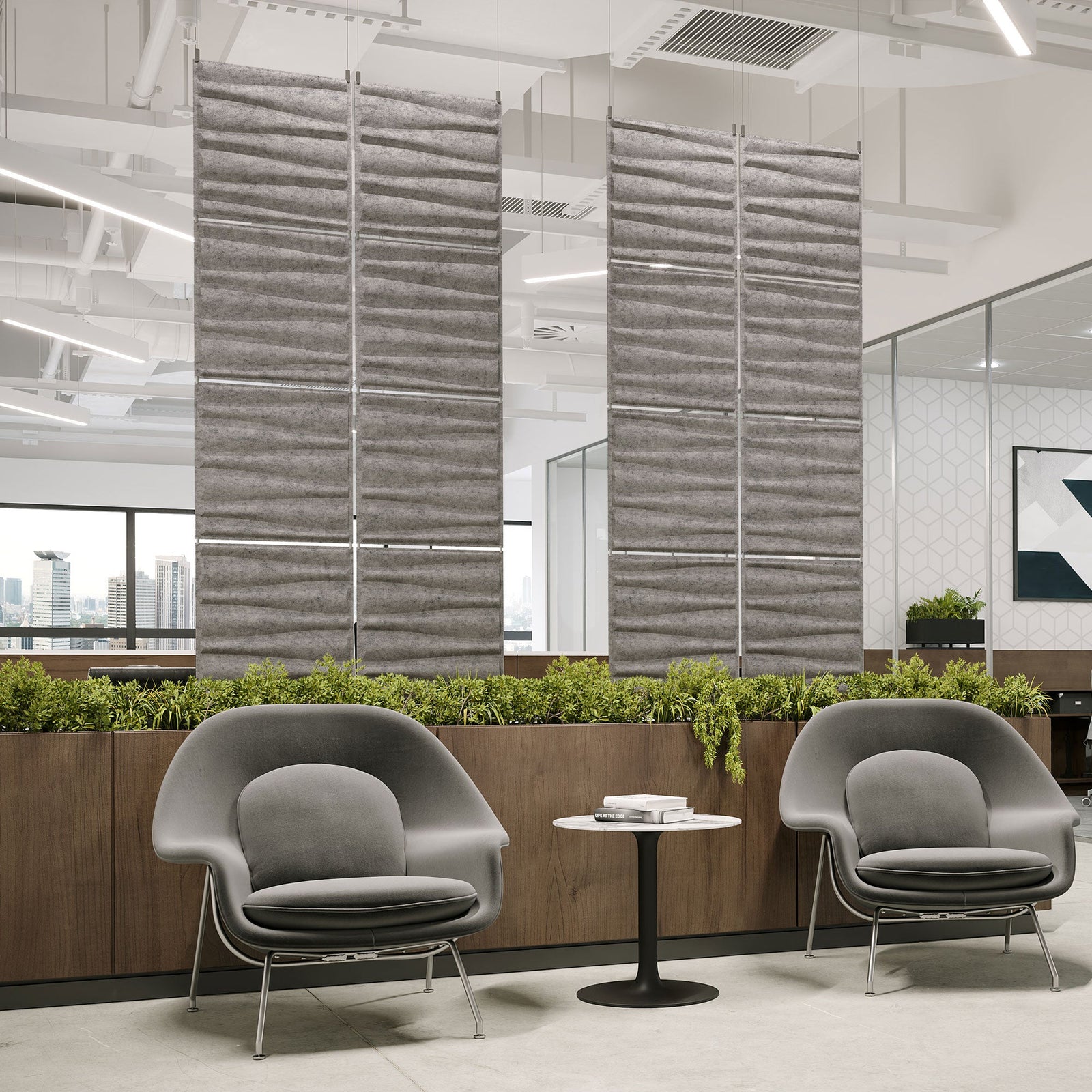 Gray Drift Harmony3D PET felt hanging acoustic panels dividing a modern office seating area by Inhabit