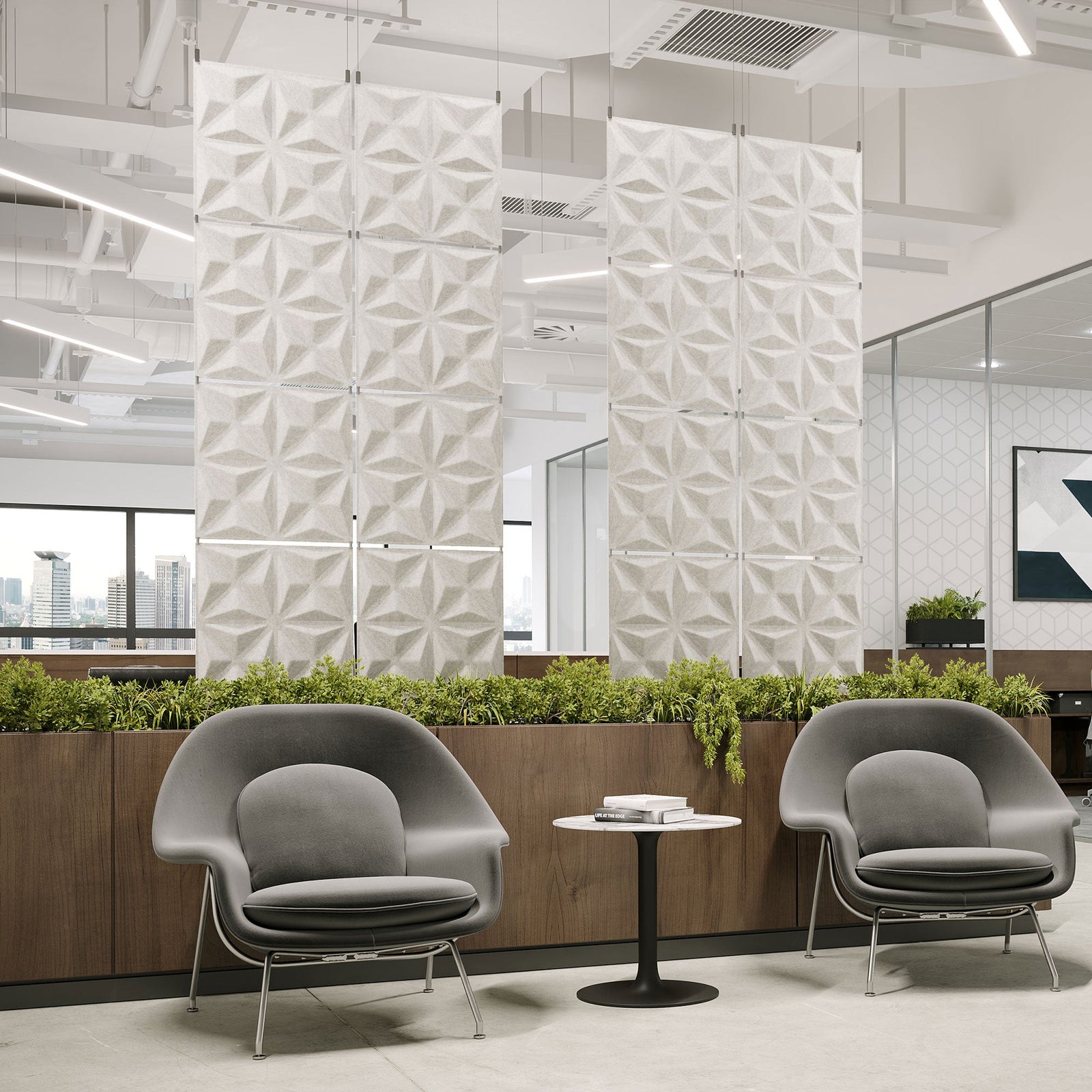 White Facet Harmony3D PET felt hanging acoustic panels dividing a modern office seating area