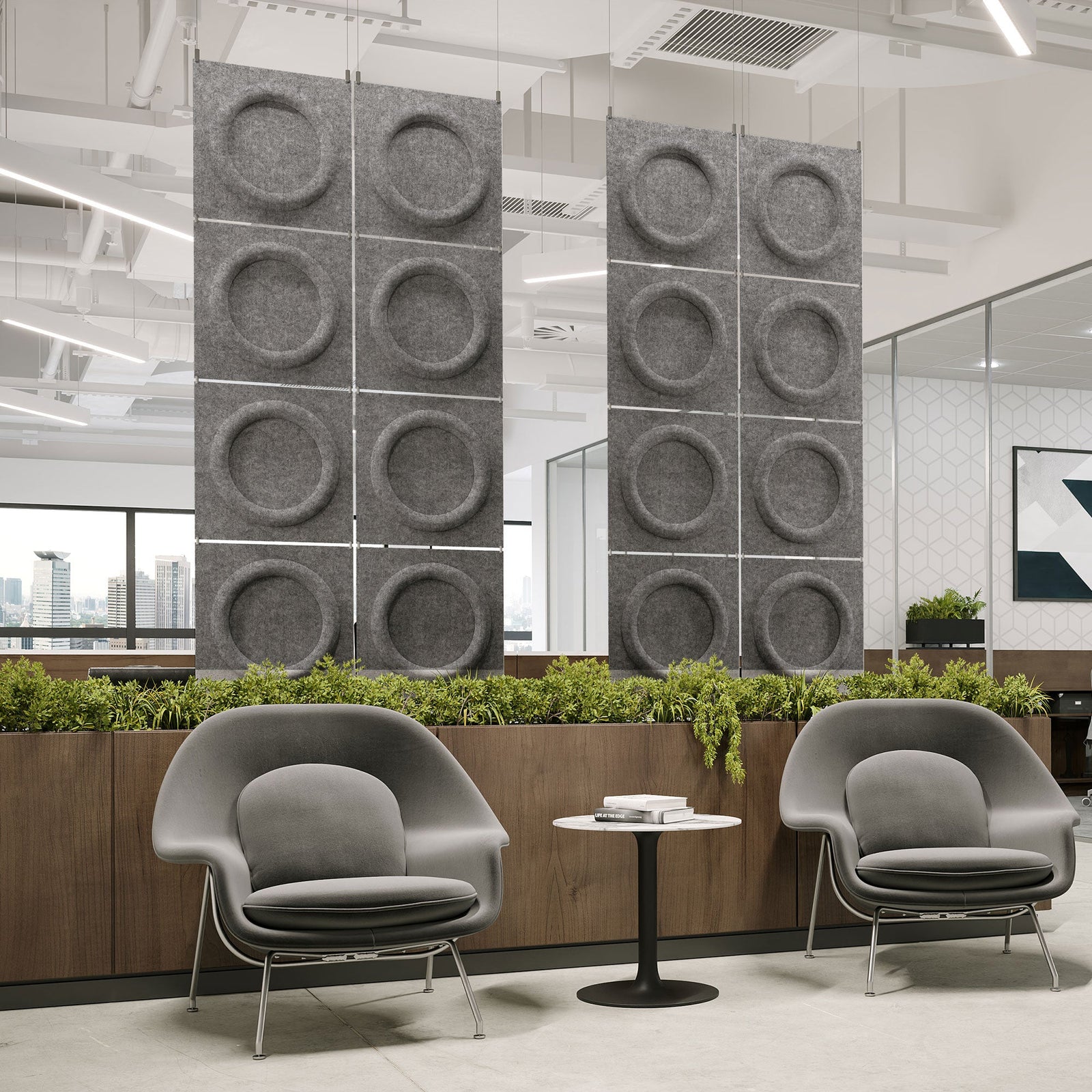 Medium gray Halo Harmony3D PET felt hanging acoustic panels dividing a modern office seating area