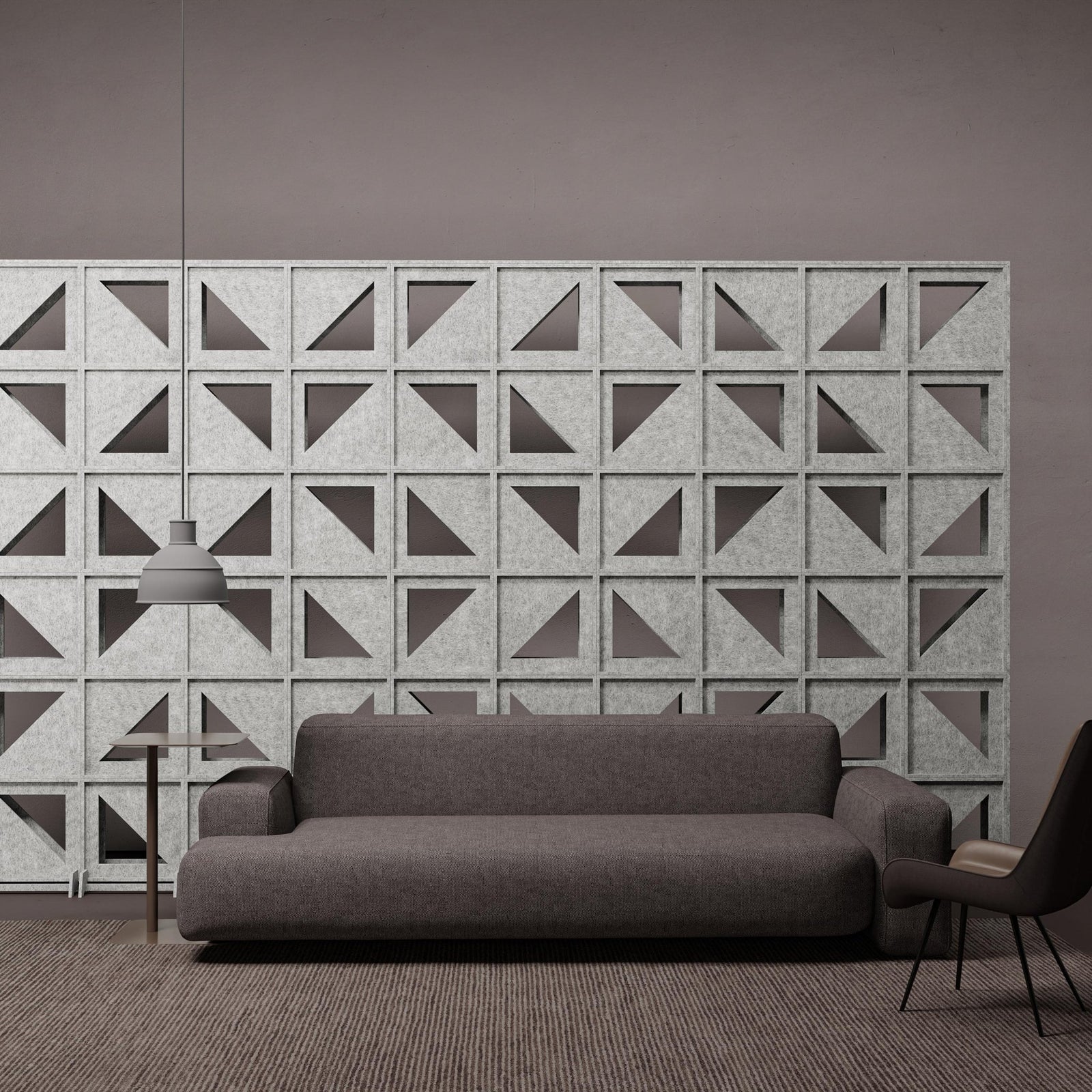 Hatch HarmonyBLOKS geometric acoustic divider wall in a modern lounge.
