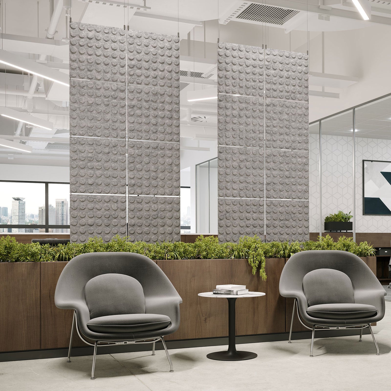 Light gray Loop Harmony3D PET felt hanging acoustic panels dividing a modern office seating area by Inhabit