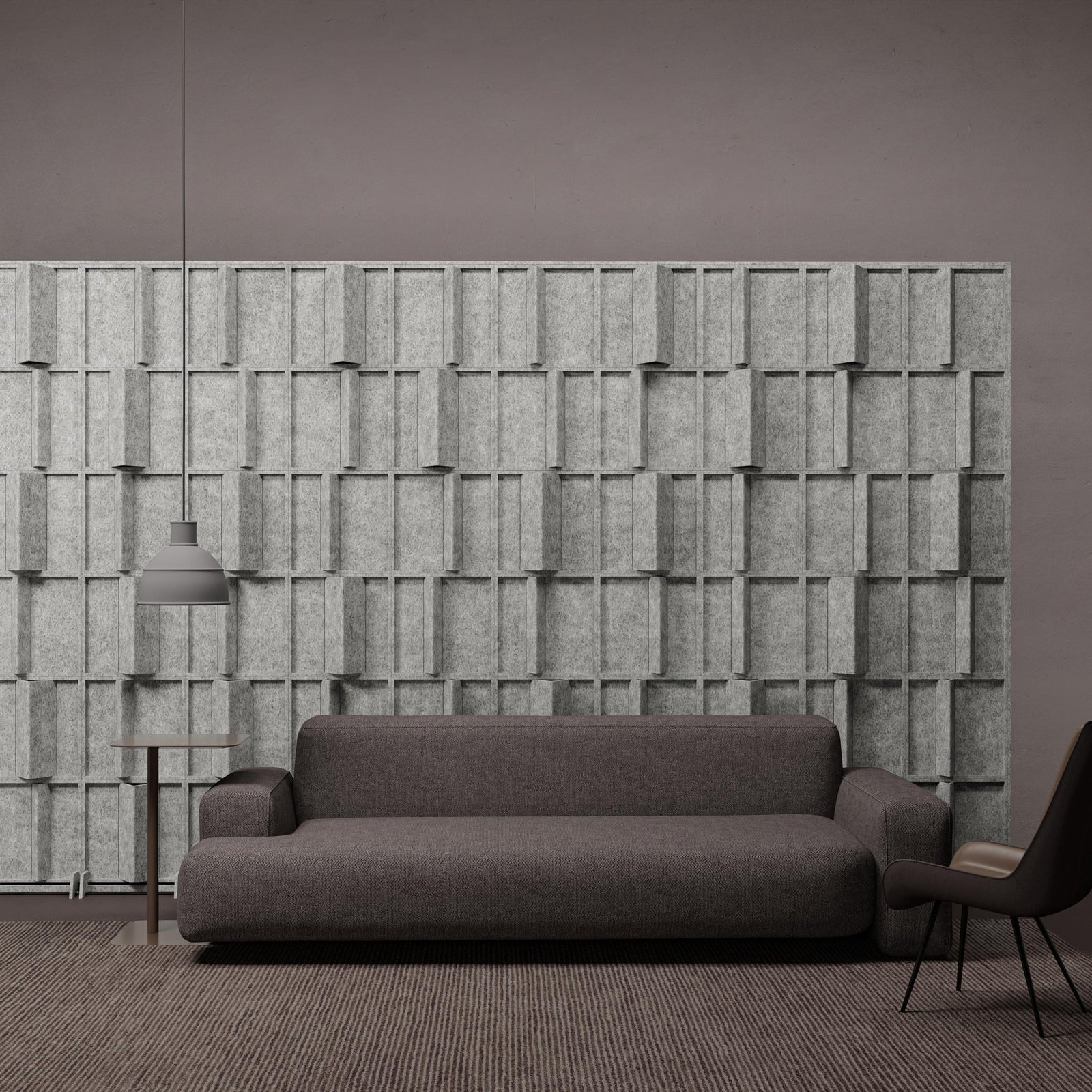 Pleat HarmonyBLOKS PET felt acoustic room divider behind a gray sofa by Inhabit.