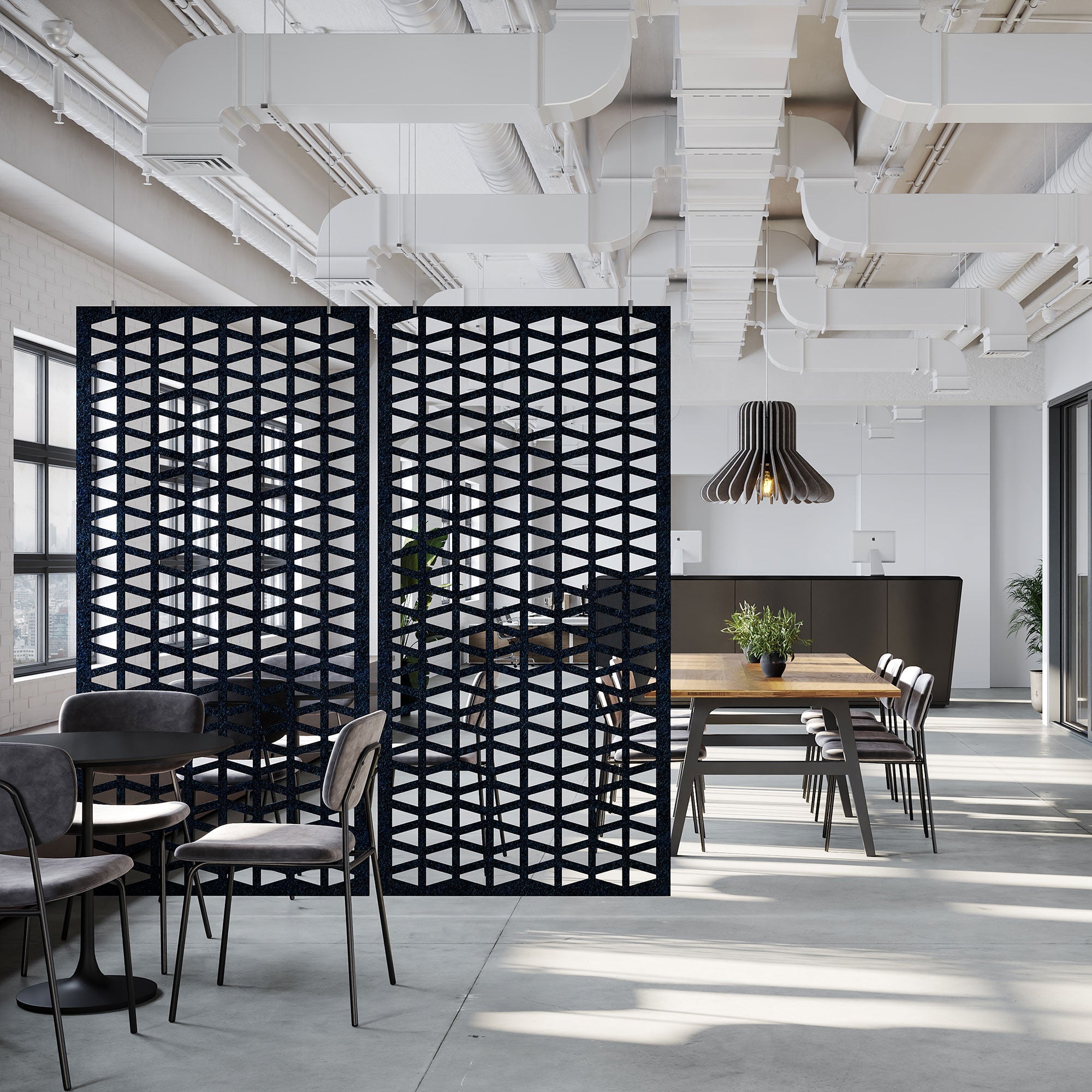 Black Sequence HarmonyDIVDR acoustic felt hanging dividers separating a modern meeting and dining area