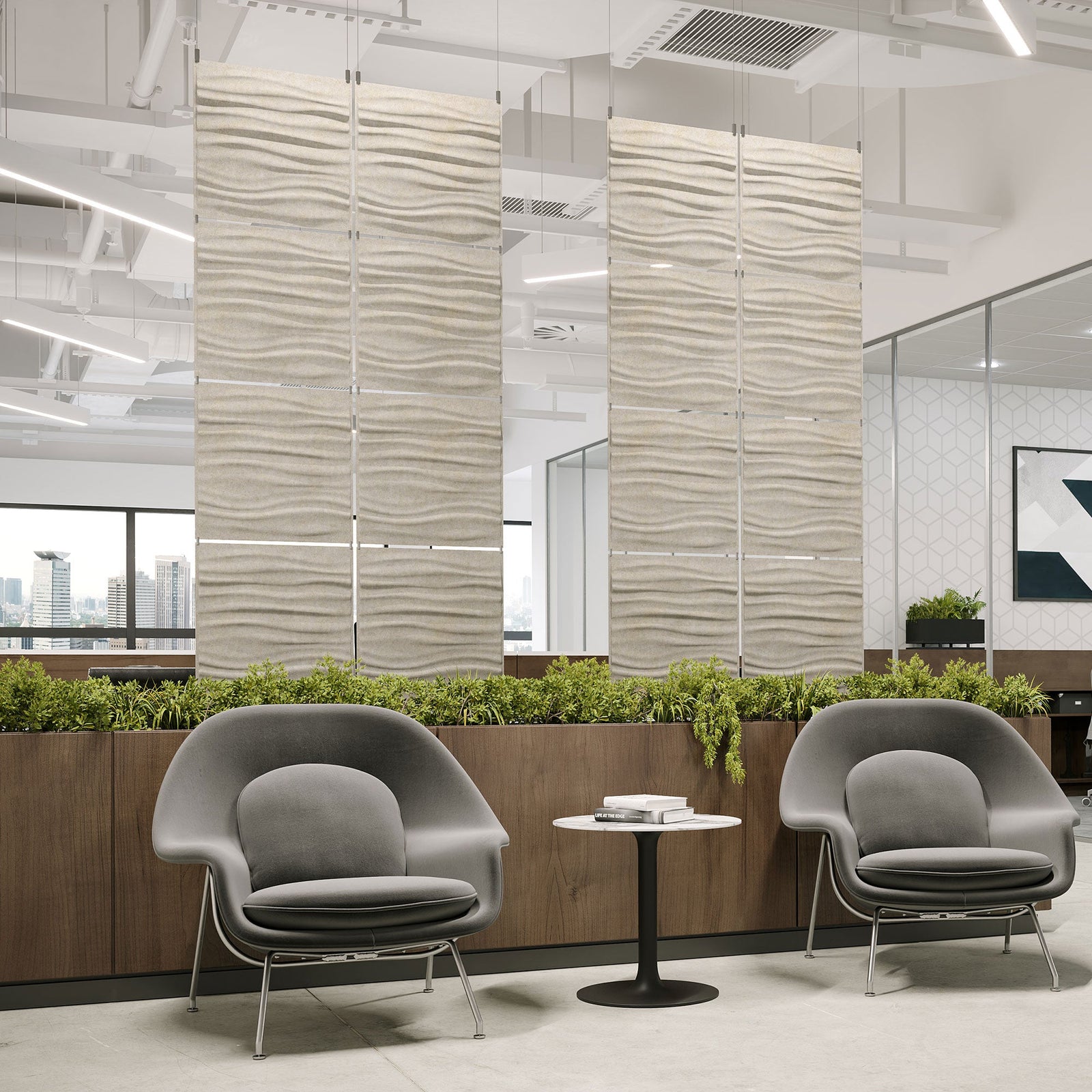 Ivory Tidal Harmony3D PET felt hanging acoustic panels dividing a modern office seating area