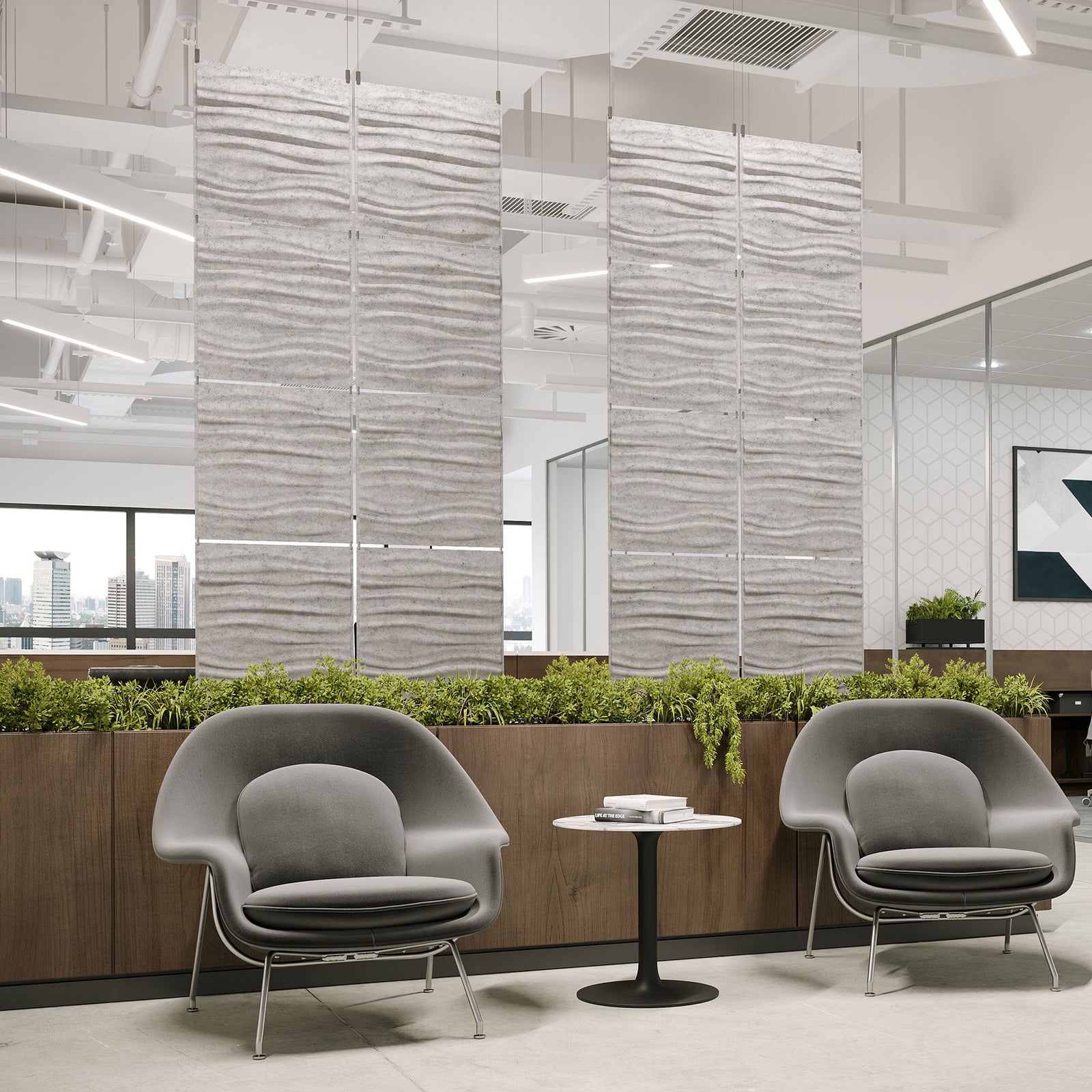 Light gray Tidal Harmony3D PET felt hanging acoustic panels dividing a modern office seating area by Inhabit
